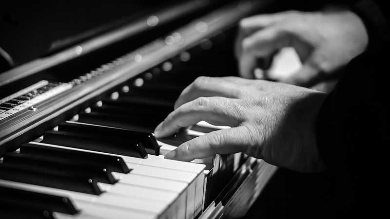 Adult playing the piano